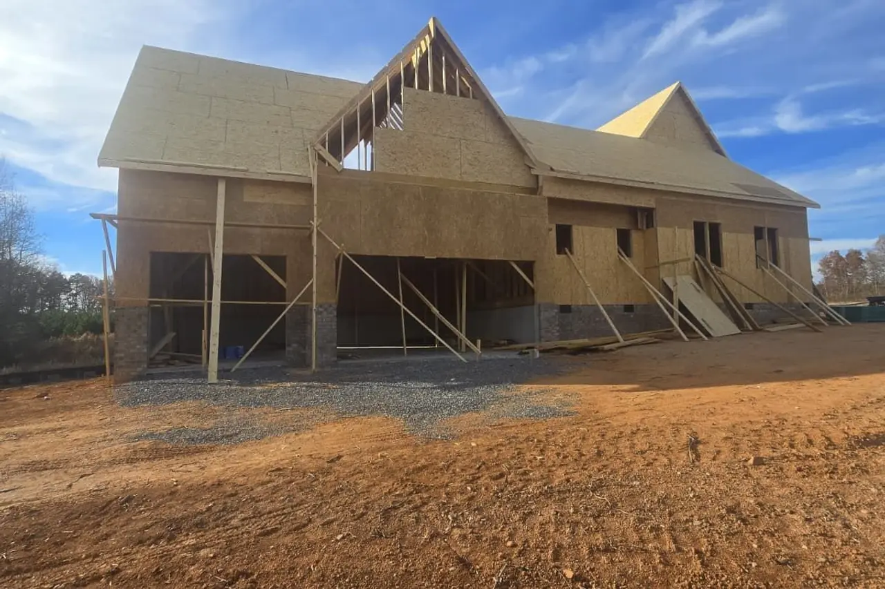 New home under construction with the wood framing up